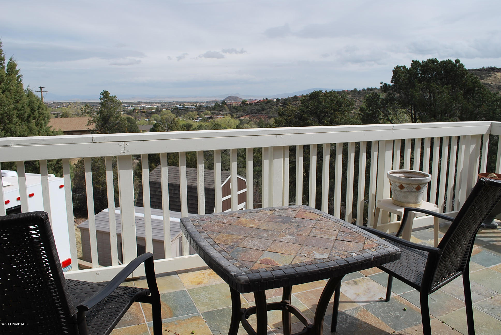 2701 Ridge Road Prescott, AZ 86301 - Photo 8 of 39 a view of a balcony with wooden floor table and chairs