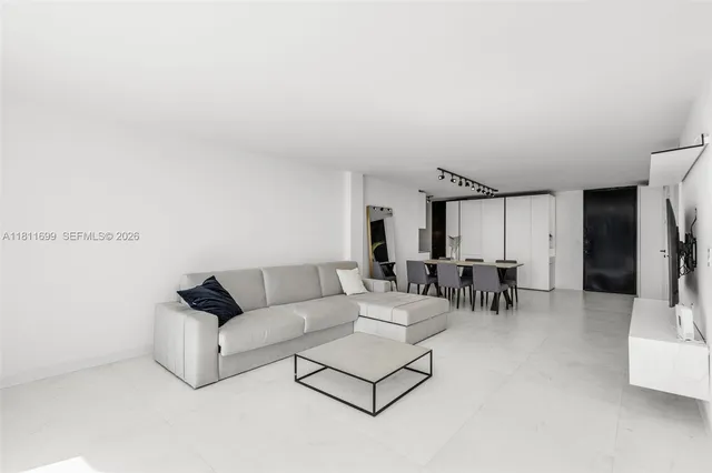 a kitchen with stainless steel appliances a refrigerator and a sink
