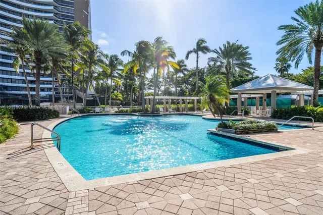 a view of a swimming pool with a patio