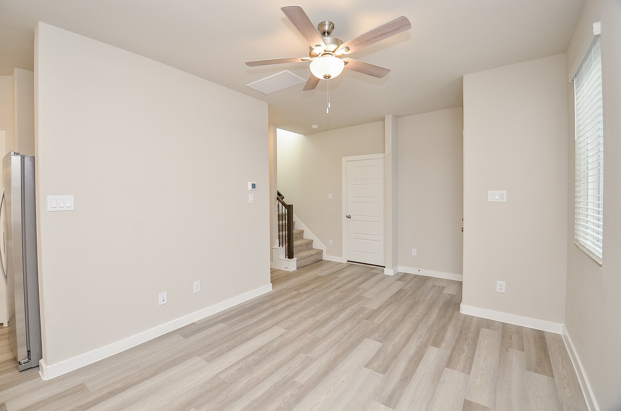 3107 Boulder Rnch Drive Houston, TX 77063 - Photo 12 of 40 wooden floor in an empty room with a window