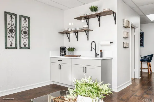 a bathroom with a sink mirror and vanity