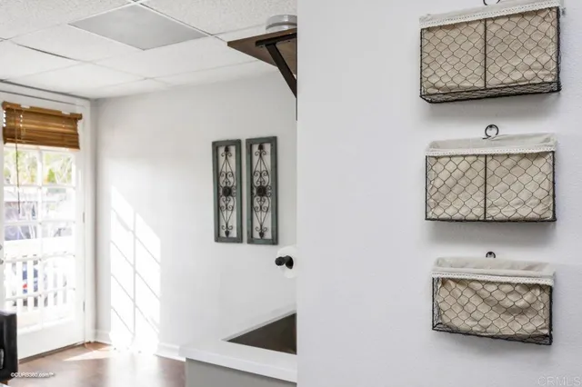 a view of a workspace with furniture and a potted plant