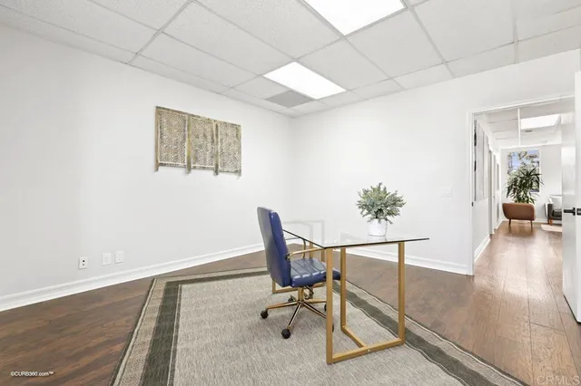 a workspace with furniture and wooden floor