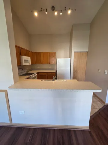 a view of kitchen with furniture and wooden floor