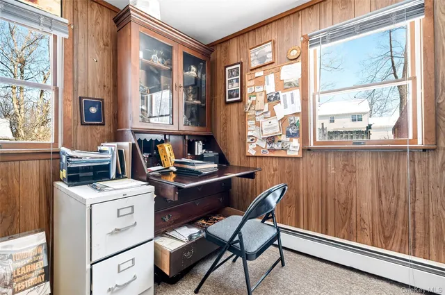 a view of dining room and kitchen with a window