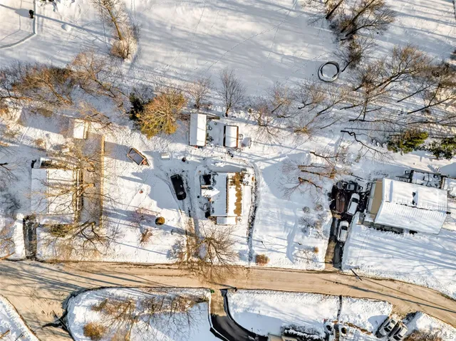 a view of a house with snow on the wall