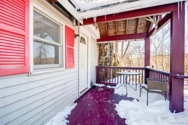 a view of a balcony with furniture
