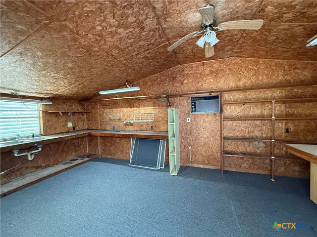 a view of a balcony with furniture and wooden floor