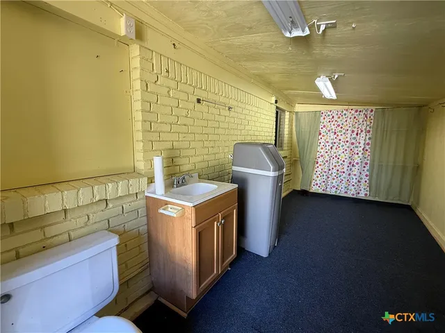 a view of a patio front of house