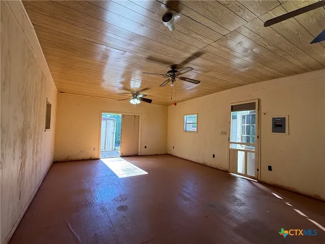 a view of porch with wooden floor