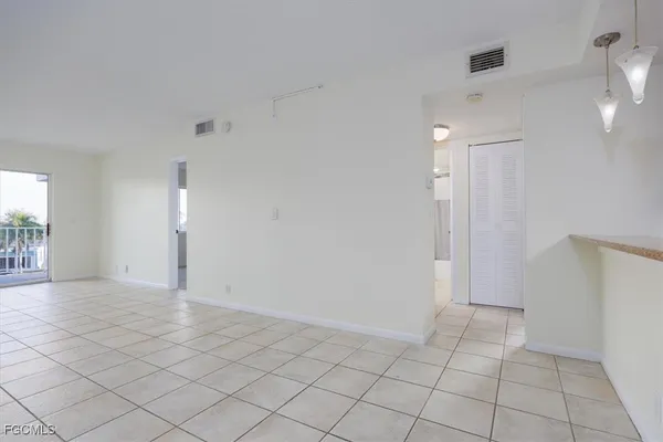 a view of an empty room and window