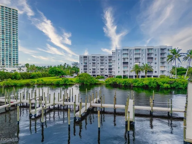 a view of a lake with outdoor seating and lake view