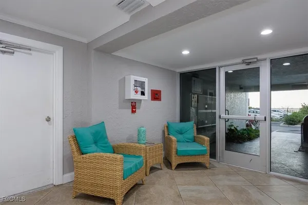 a swimming pool with outdoor seating