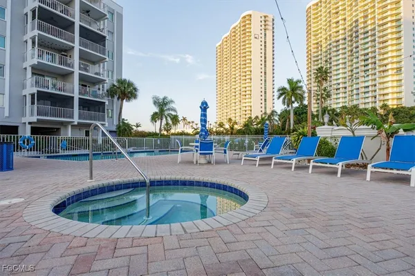a view of a city with tall buildings and a big yard