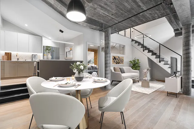 a dining room with furniture and wooden floor