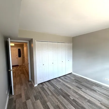 wooden floor and windows in an empty room