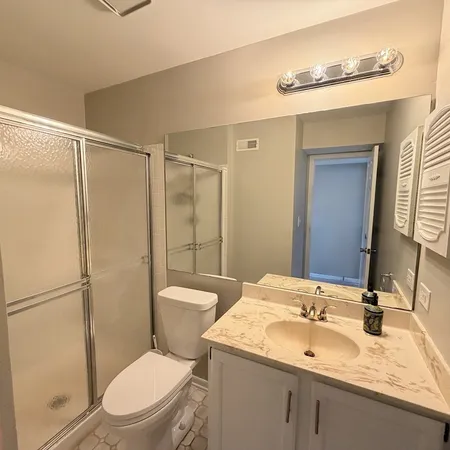 an empty room with a cabinet and mirror