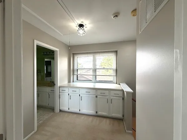 a side view of a house with a yard