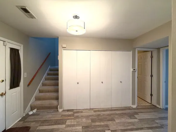 a view of entryway with wooden floor