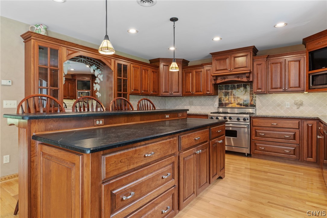 1103 Rail Fence Road Camillus, NY 13031 - Photo 18 of 50 So much storage and counter space, perfect for baking and entertaining. Pendant lighting and recessed lighting brighten up the space.