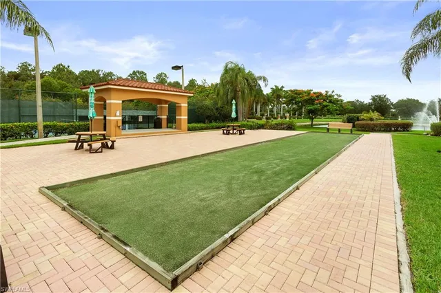 a view of a swimming pool and a yard