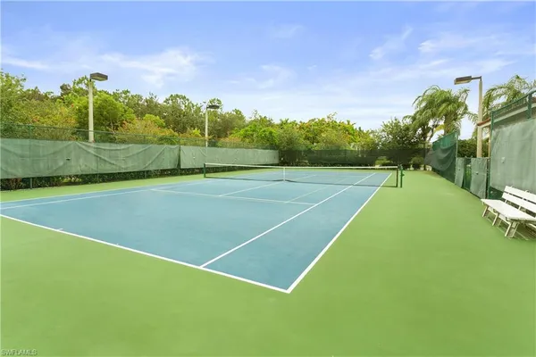 a view of an outdoor space and tennis court