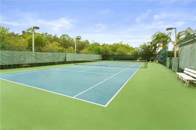a view of an outdoor space and tennis court