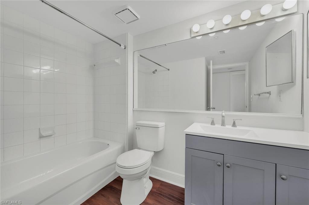 Undisclosed Address Naples, FL 34112 - Photo 7 of 23 a bathroom with a sink a toilet and shower