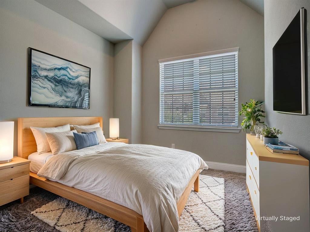 6120 Rilla Street Frisco, TX 75035 - Photo 14 of 20 a bedroom with a bed and a couch