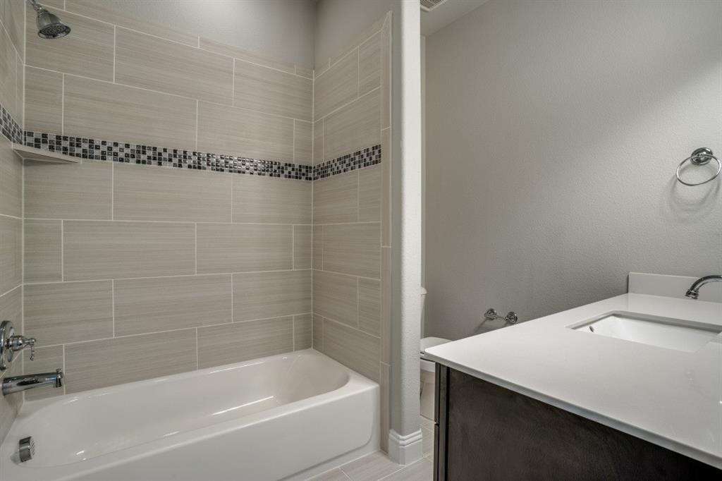6120 Rilla Street Frisco, TX 75035 - Photo 18 of 20 a bathroom with a bathtub and shower