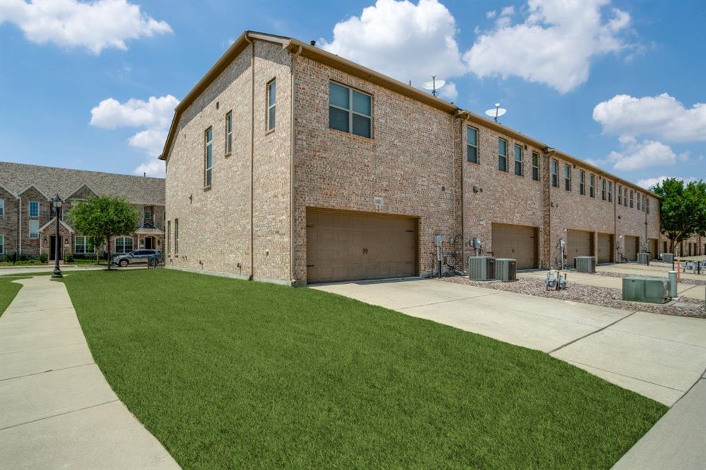 6120 Rilla Street Frisco, TX 75035 - Photo 19 of 20 a front view of a house with a yard and garage