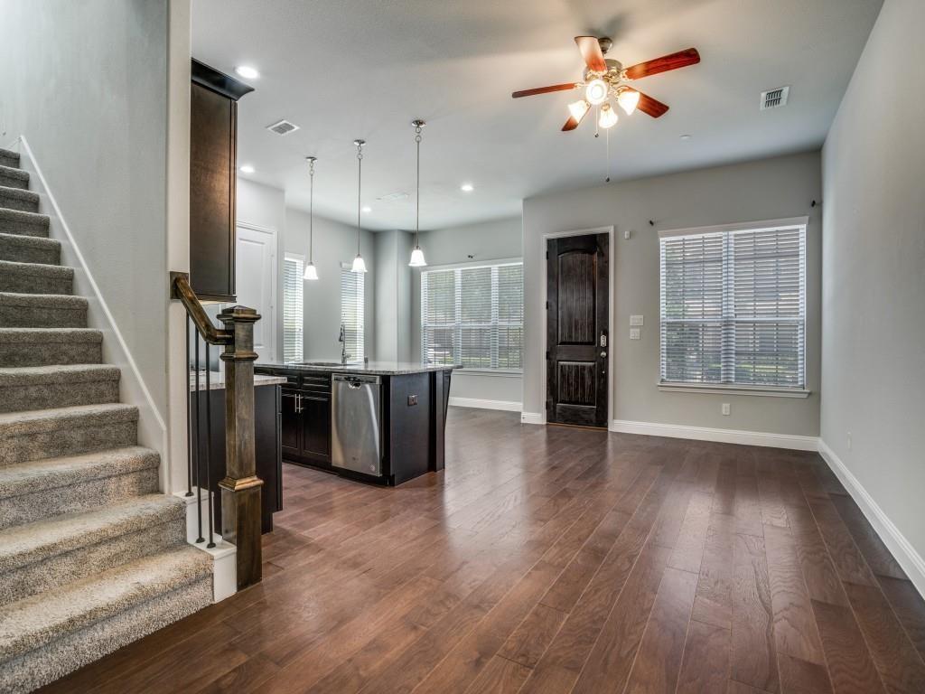 6120 Rilla Street Frisco, TX 75035 - Photo 4 of 20 a view of a room with wooden floors and stairs