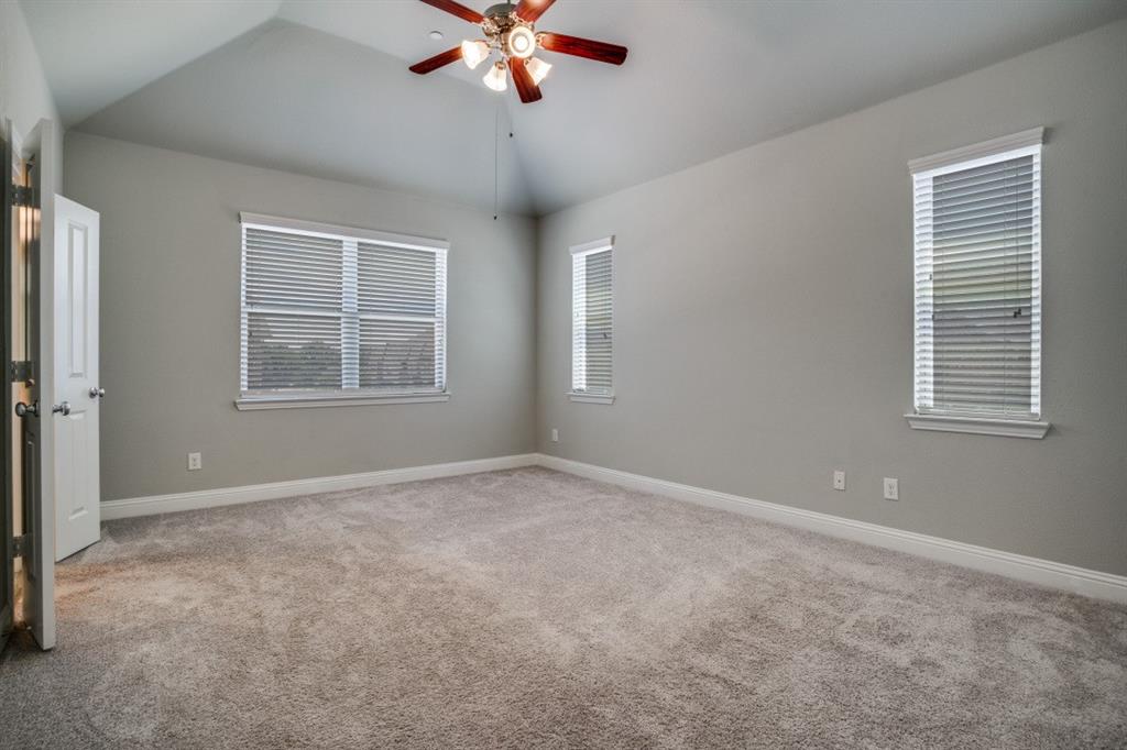 6120 Rilla Street Frisco, TX 75035 - Photo 9 of 20 an empty room with windows and fan