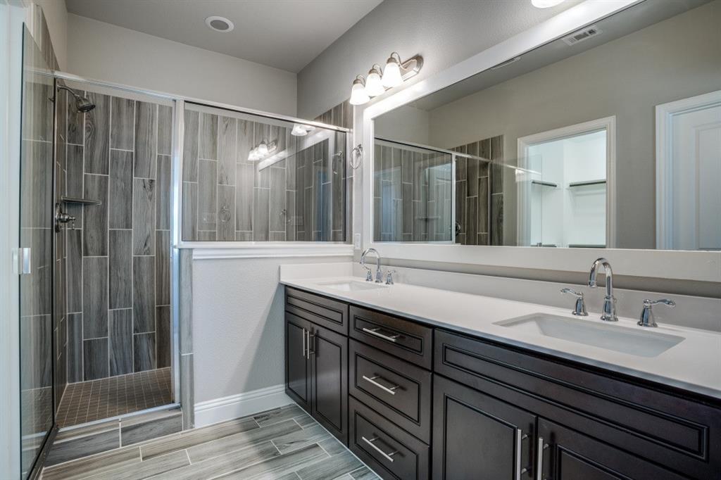 6120 Rilla Street Frisco, TX 75035 - Photo 10 of 20 a bathroom with double vanity sink and a mirror