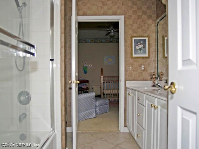10027 Deercreek Club Road Jacksonville, FL 32256 - Photo 11 of 15 a en suite bathroom with a shower