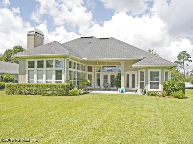 10027 Deercreek Club Road Jacksonville, FL 32256 - Photo 14 of 15 a front view of a building with a garden
