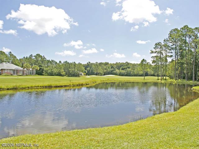 10027 Deercreek Club Road Jacksonville, FL 32256 - Photo 15 of 15 a view of a lake with a yard