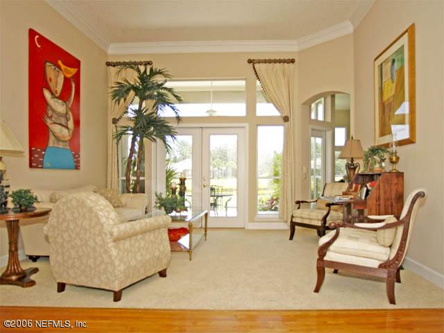 10027 Deercreek Club Road Jacksonville, FL 32256 - Photo 2 of 15 a living room with furniture and a large window