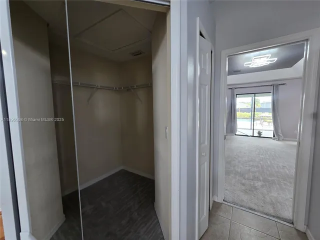 a bathroom that has a glass door