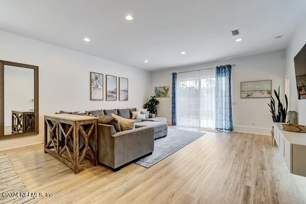 3081 Pullian Court Jacksonville Beach, FL 32250 - Photo 19 of 56 a living room with furniture and a flat screen tv