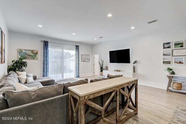 3081 Pullian Court Jacksonville Beach, FL 32250 - Photo 21 of 56 a view of a dining room with furniture and wooden floor