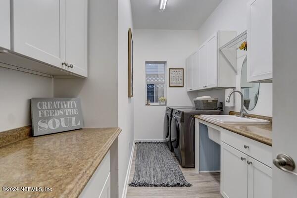 3081 Pullian Court Jacksonville Beach, FL 32250 - Photo 24 of 56 a kitchen with stainless steel appliances granite countertop a sink stove and cabinets