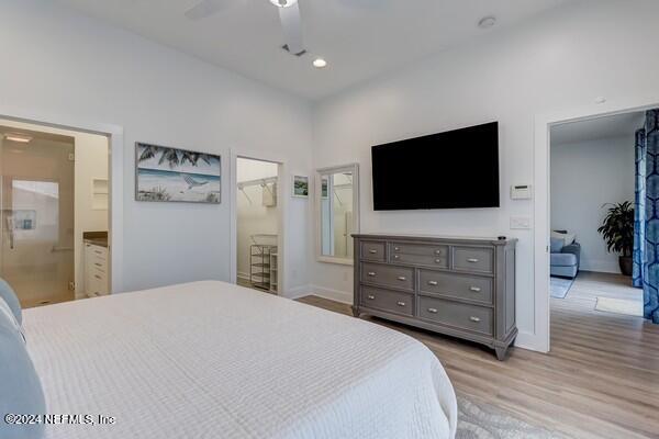 3081 Pullian Court Jacksonville Beach, FL 32250 - Photo 26 of 56 a bedroom with a bed and a flat screen tv in it