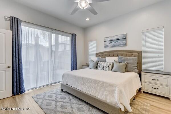 3081 Pullian Court Jacksonville Beach, FL 32250 - Photo 28 of 56 a bedroom with a large bed and a window