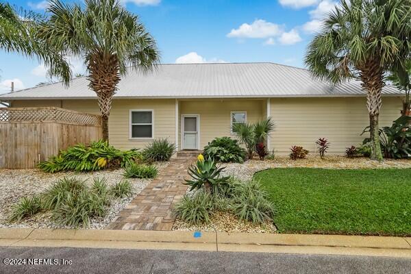 3081 Pullian Court Jacksonville Beach, FL 32250 - Photo 3 of 56 a front view of a house with garden