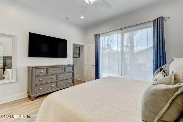 3081 Pullian Court Jacksonville Beach, FL 32250 - Photo 31 of 56 a bedroom with a bed and a flat screen tv