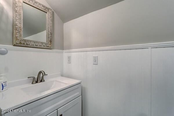 3081 Pullian Court Jacksonville Beach, FL 32250 - Photo 38 of 56 a close view of a sink and a mirror