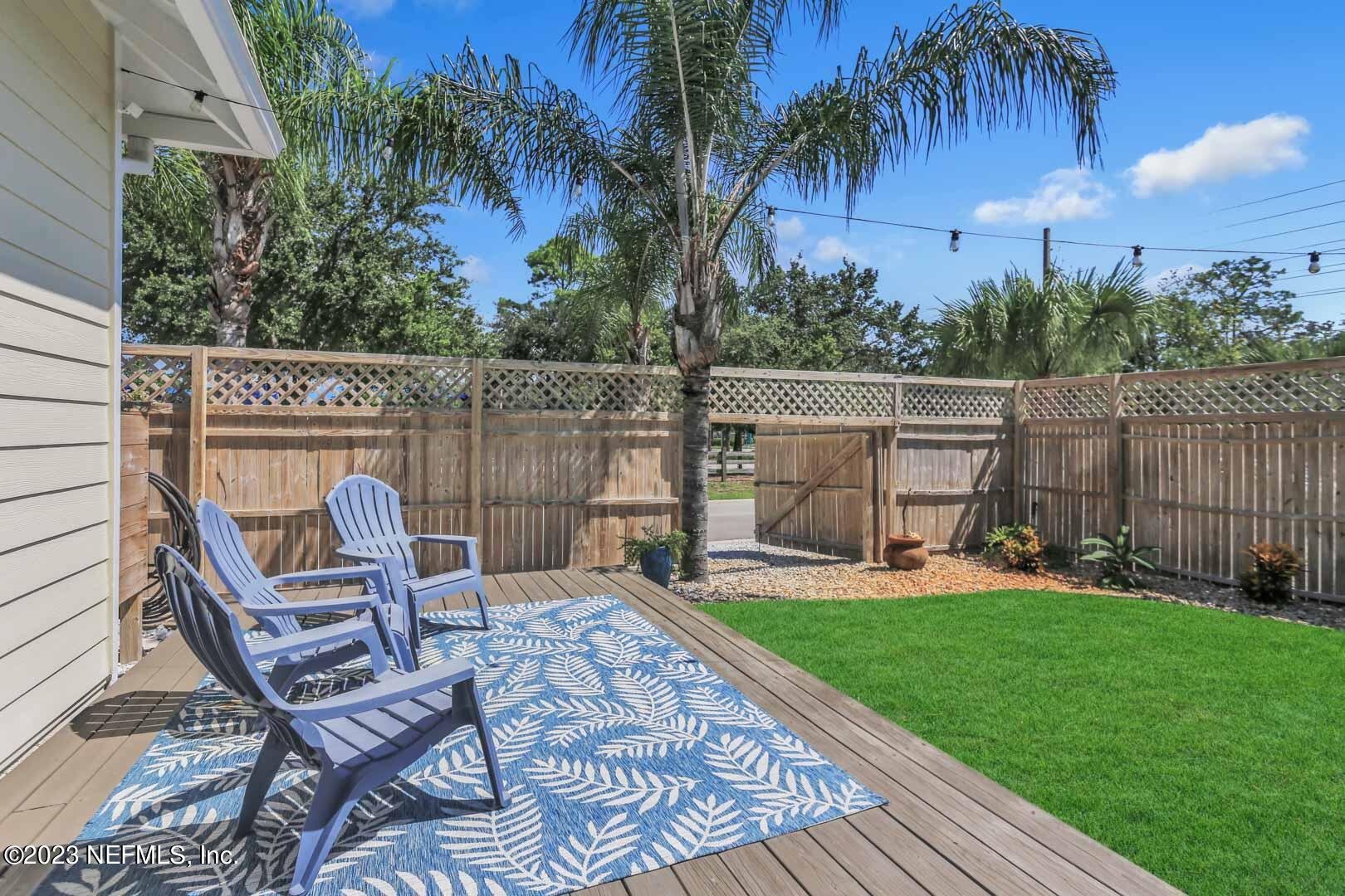 3081 Pullian Court Jacksonville Beach, FL 32250 - Photo 47 of 56 a view of a chair and tables in the patio