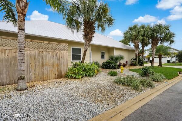 3081 Pullian Court Jacksonville Beach, FL 32250 - Photo 5 of 56 a front view of a house with garden