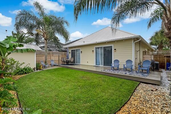 3081 Pullian Court Jacksonville Beach, FL 32250 - Photo 51 of 56 a view of a house with backyard and a tree